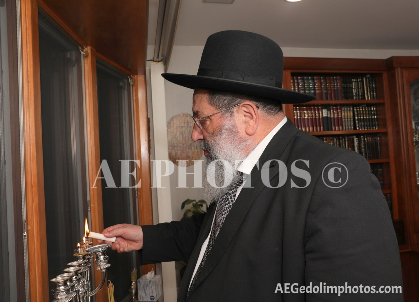 Rav Yaakov Bender lighting Menorah 2023